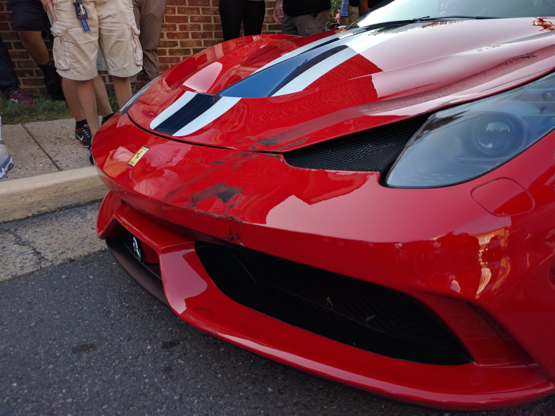 Illustration for article titled Ferrari 458 Speciale Mutilated In Front Of Children At Cars & Coffee